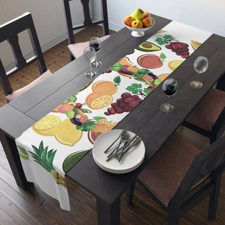Vibrant fruit designed table runner XL on a dining table, enhancing kitchen decor with lively colors.